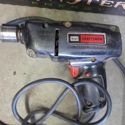 3/8-inch electric drill with an assortment of drill bits