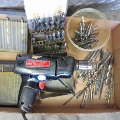 3/8-inch electric drill with an assortment of drill bits