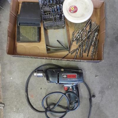 3/8-inch electric drill with an assortment of drill bits