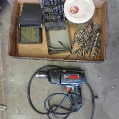 3/8-inch electric drill with an assortment of drill bits