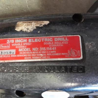 3/8-inch electric drill with an assortment of drill bits