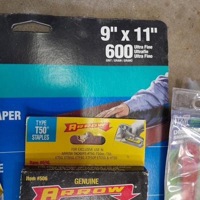 Stapler, staples and sandpaper