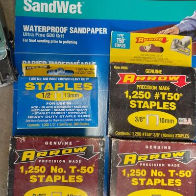 Stapler, staples and sandpaper