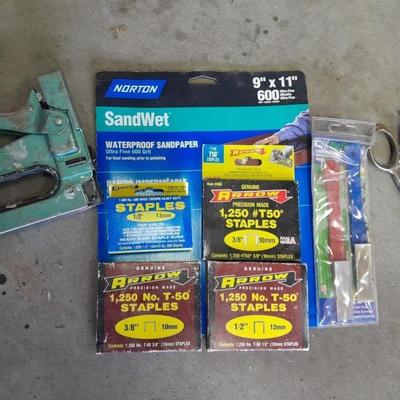 Stapler, staples and sandpaper