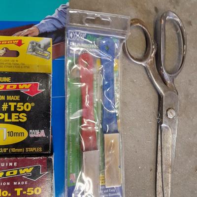 Stapler, staples and sandpaper