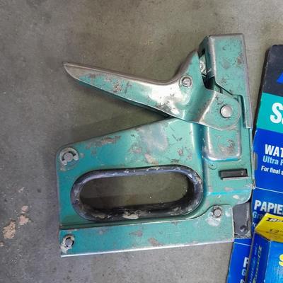 Stapler, staples and sandpaper