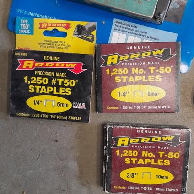 Stapler, staples and sandpaper