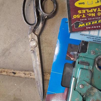 Stapler, staples and sandpaper