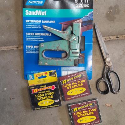 Stapler, staples and sandpaper