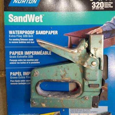 Stapler, staples and sandpaper