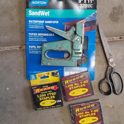 Stapler, staples and sandpaper