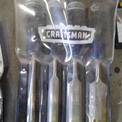 Soft sided Craftsman tool bag with an assortment of tools