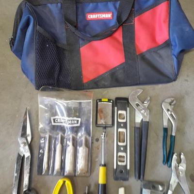 Soft sided Craftsman tool bag with an assortment of tools