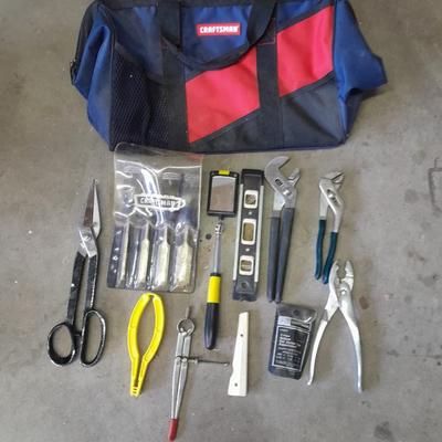 Soft sided Craftsman tool bag with an assortment of tools