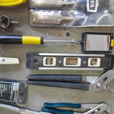 Soft sided Craftsman tool bag with an assortment of tools