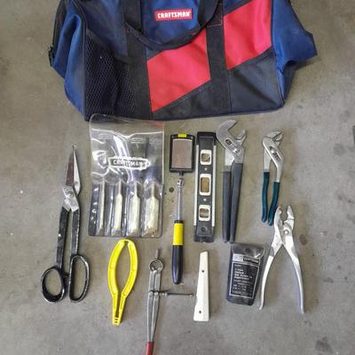Soft sided Craftsman tool bag with an assortment of tools