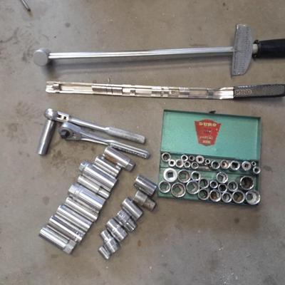 A bunch of different sockets and a torque wrench