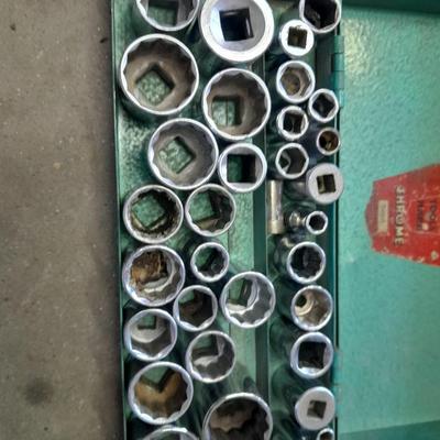 A bunch of different sockets and a torque wrench