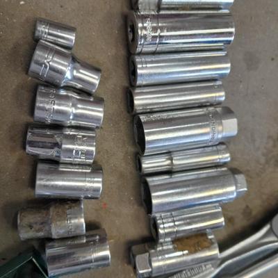 A bunch of different sockets and a torque wrench