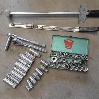 A bunch of different sockets and a torque wrench