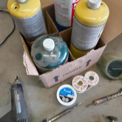 Propane torches, partially full bottles and a glue gun