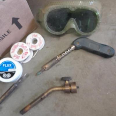 Propane torches, partially full bottles and a glue gun