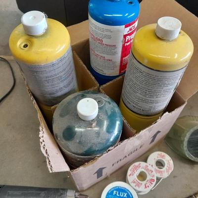 Propane torches, partially full bottles and a glue gun