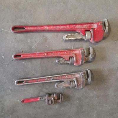 Four pipe wrenches