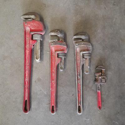 Four pipe wrenches