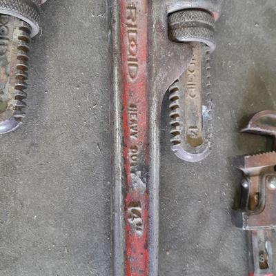 Four pipe wrenches