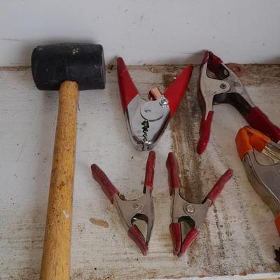 Assortment of hand clamps and a rubber mallet