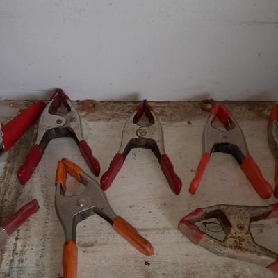 Assortment of hand clamps and a rubber mallet