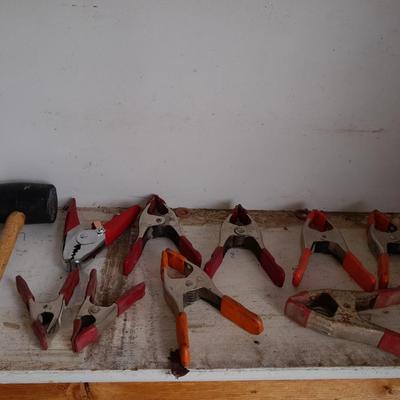 Assortment of hand clamps and a rubber mallet