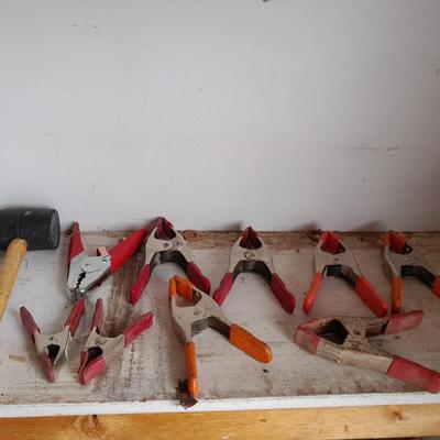 Assortment of hand clamps and a rubber mallet