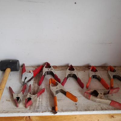 Assortment of hand clamps and a rubber mallet