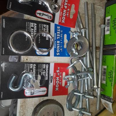 Boxes, and cans full of home hardware - screws- clips- nails etc.