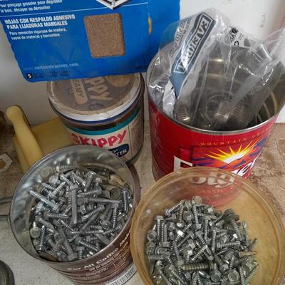 Boxes, and cans full of home hardware - screws- clips- nails etc.