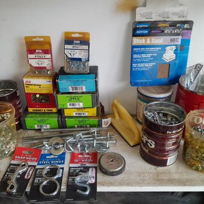 Boxes, and cans full of home hardware - screws- clips- nails etc.
