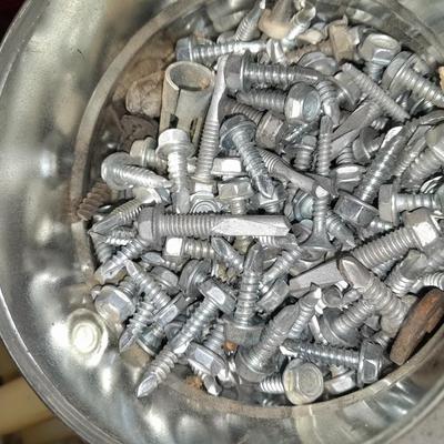 Boxes, and cans full of home hardware - screws- clips- nails etc.