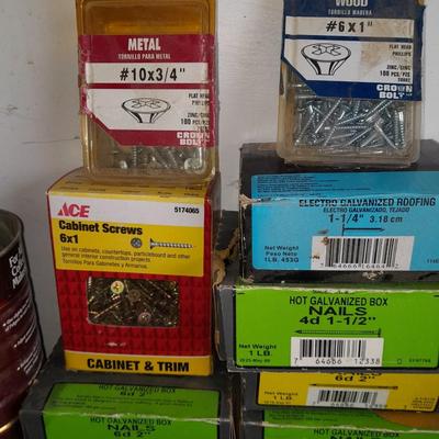 Boxes, and cans full of home hardware - screws- clips- nails etc.