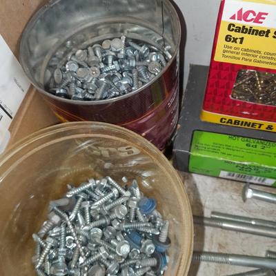 Boxes, and cans full of home hardware - screws- clips- nails etc.
