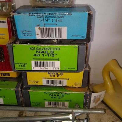 Boxes, and cans full of home hardware - screws- clips- nails etc.