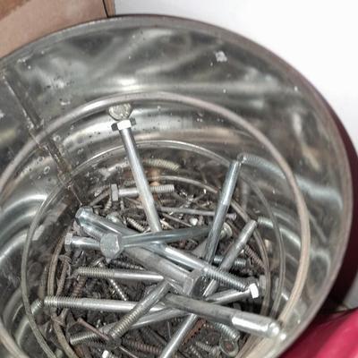 Packages, and cans full of home hardware - bolts, nuts, bins, and more