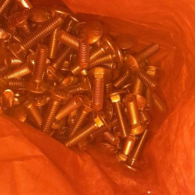 Packages, and cans full of home hardware - bolts, nuts, bins, and more