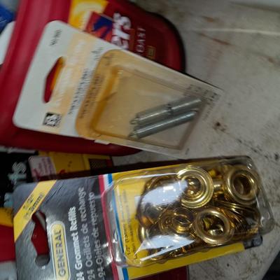 Packages, and cans full of home hardware - bolts, nuts, bins, and more