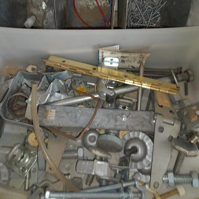 Packages, and cans full of home hardware - bolts, nuts, bins, and more