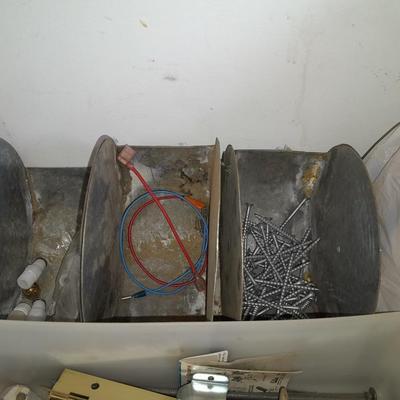 Packages, and cans full of home hardware - bolts, nuts, bins, and more