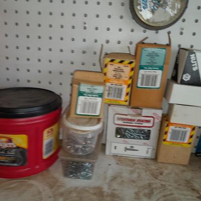 Boxes, and cans full of home hardware - bolts, nuts, nails, and more