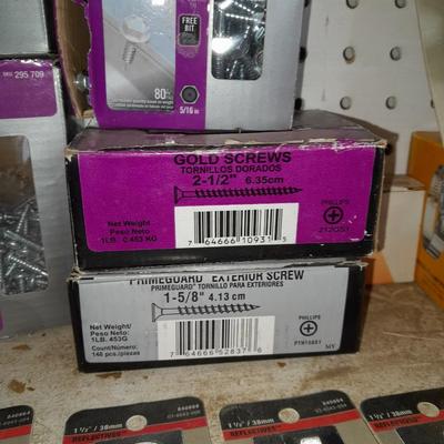 Boxes, and cans full of home hardware - bolts, nuts, nails, and more