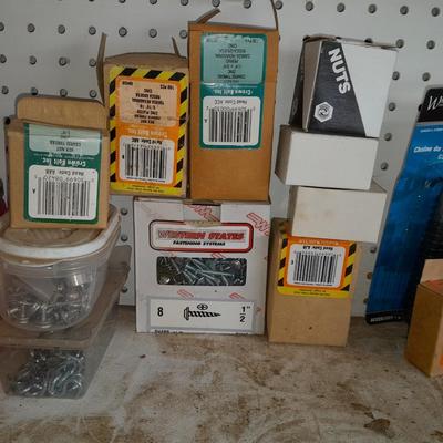 Boxes, and cans full of home hardware - bolts, nuts, nails, and more